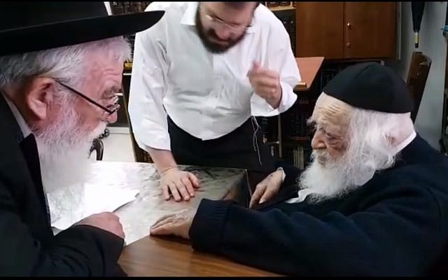 Rabbi Chaim Kanievsky (r), of Bnei Brak, is asked whether Florida Jews may break Shabbat to flee Hurricane Irma. (Screen captur/YouTube)