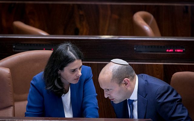 Jewish Home leader Naftali Bennett (R) with Jewish Home MK and Justice Minister Ayelet Shaked in the Knesset plenum, on November 16, 2016. (Yonatan Sindel/Flash90)