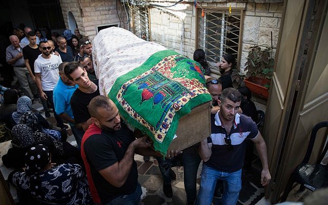 Friends and family carry the body of Youssef Ottman during his funeral in Abu Ghosh, September 26, 2017. (Hadas Parush/Flash90)