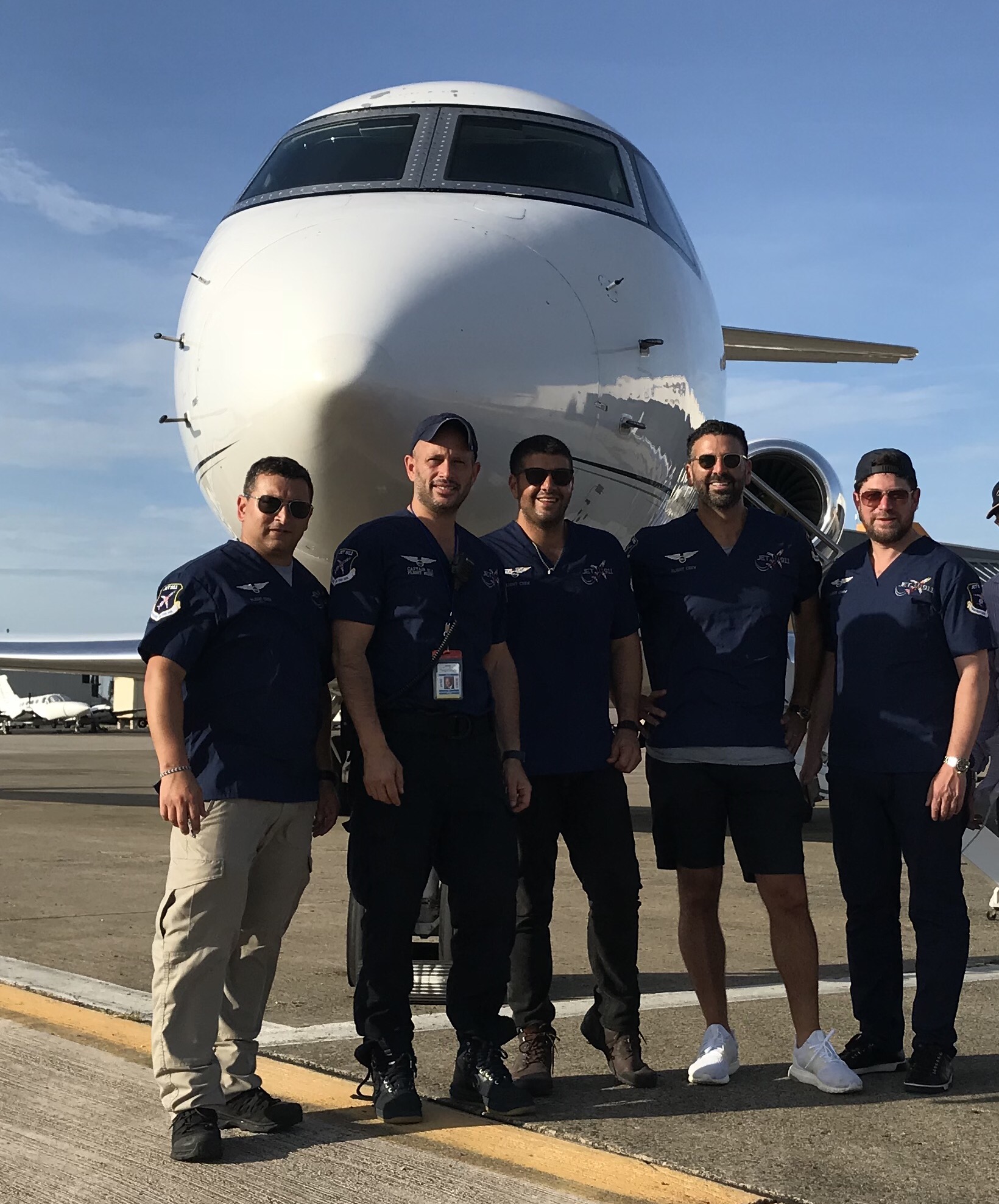 Eli Rowe, second from left, with members of his volunteer aid team from New York standing in front of the airplane that was donated to make the trip to San Juan, September 25, 2017. (Courtesy of Rowe/via JTA)
