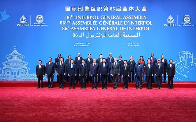 The leaders of the Interpol General Assembly posing at the Beijing National Convention Center, Sept. 26, 2017. (Lintao Zhang/Pool/Getty Images)
