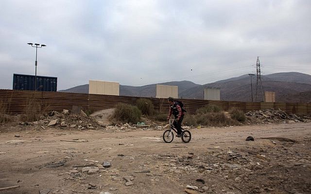 View from the Tijuana side, Mexico, on October 12, 2017 of  prototypes of US President Donald Trump's US-Mexico border wall being built near San Diego, in the US.  
(AFP/GUILLERMO ARIAS)