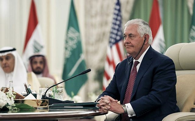 US Secretary of State Rex Tillerson listens through his earpiece to a speech translation during a meeting of the Saudi-Iraqi Bilateral Coordination Council in the capital Riyadh, October 22, 2017. (AFP/Alex Brandon)