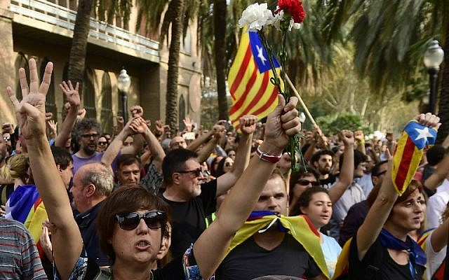 People celebrate after Catalonia's parliament voted to declare independence from Spain on October 27, 2017 in Barcelona. ( AFP PHOTO / PIERRE-PHILIPPE MARCOU)