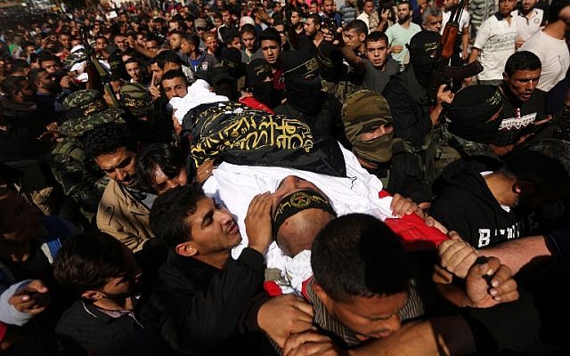 Mourners carry the coffin of Palestinian Islamic Jihad Movement terrorist Arafat Abu Morshed during the funeral at the Bureij refugee camp, in central Gaza of Palestinians killed in an Israeli operation to blow up a tunnel stretching from the Gaza Strip into Israel, on October 31, 2017. (Mahmud Hams/AFP)
