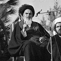 Ayatollah Khomeini speaks to followers at Behesht Zahra Cemetery after his arrival in Tehran, Iran, ending 14 years of exile, on February 1, 1979. (AP Photo/ File)