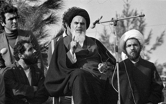 Ayatollah Khomeini speaks to followers at Behesht Zahra Cemetery after his arrival in Tehran, Iran, ending 14 years of exile, on February 1, 1979. (AP Photo/ File)