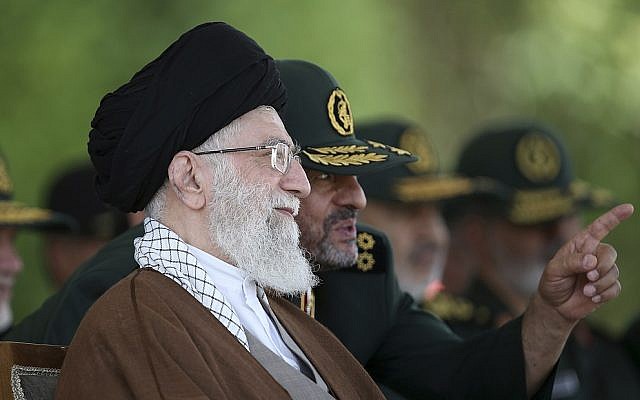 In this Wednesday, May 20, 2015 file picture released by the official website of the office of the Iranian supreme leader, Ayatollah Ali Khamenei listens to IRGC commander Mohammad Ali Jafari during a graduation ceremony of officers in Tehran, Iran. (Office of the Iranian Supreme Leader via AP, File)