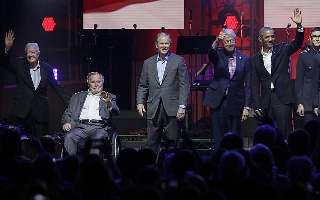 Former Presidents from right, Barack Obama, Bill Clinton, George W. Bush, George H.W. Bush and Jimmy Carter gather on stage at the opening of a hurricanes relief concert in College Station, Texas, on October 21, 2017. (AP Photo/LM Otero)