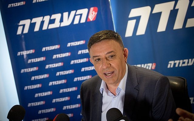 Avi Gabbay, seen at a press conference on July 11, 2017, the day after he won the Labor party leadership, with the party logo behind him. (Miriam Alster/Flash90)