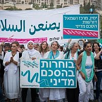 File: Women from the 'Women Wage Peace' movement take part at the final part of a peace journey in Jerusalem on October 8, 2017. (Yonatan Sindel/Flash90)
