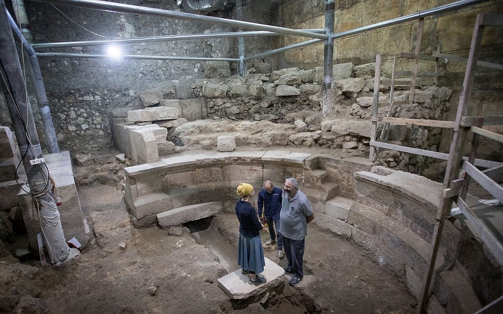Israel Antiquities Authority archaeologists (left to right) Tehillah Lieberman, Dr. Joe Uziel and Dr. Avi Solomon at the site of an ancient Roman theater-like structure, hidden for 1,700 years adjacent to the Western Wall underneath Jerusalem's Old City, on October 16, 2017 (Yonatan Sindel/Flash90)