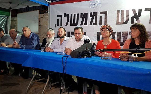 Members of the Jewish Home party sit at a protest tent with Samaria Regional Council chairman Yossi Dagan (3rd from R) outside the Prime Minister's Residence in Jerusalem on October 25, 2017. (Courtesy: Samaria Regional Council)