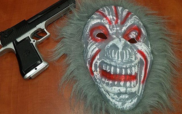 Clown mask and plastic gun confiscated from teenager in Nazareth Illit, October 6, 2017. (Israel police)