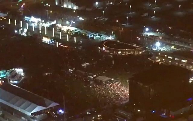 People flee the scene of a shooting in Las Vegas on October 2, 2017. (Screen capture: Twitter)
