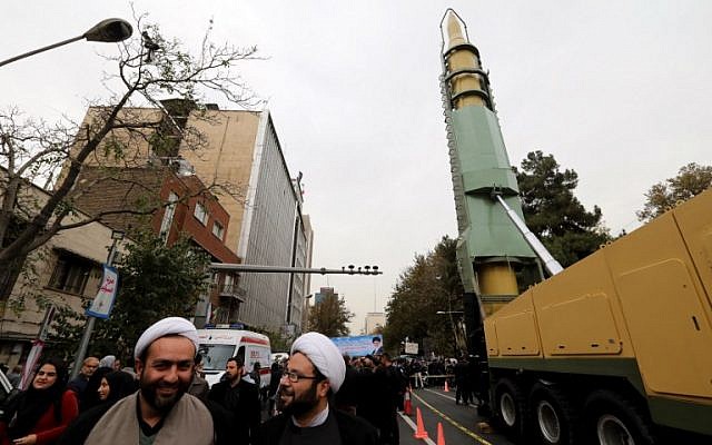 Iranians gather next to a replica of a medium-range ballistic missile during a demonstration outside the former US embassy in the Iranian capital Tehran on November 4, 2017, marking the anniversary of its storming by student protesters that triggered a hostage crisis in 1979. (AFP Photo/Atta Kenare)