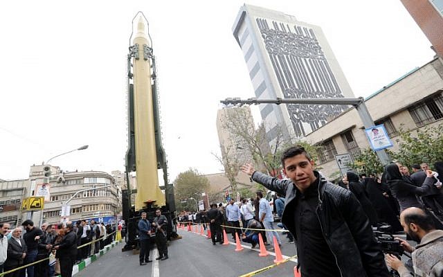 Iranians gather next to a replica of a medium-range ballistic missile during a demonstration outside the former US embassy in the Iranian capital Tehran on November 4, 2017, marking the anniversary of its storming by student protesters that triggered a hostage crisis in 1979. (AFP Photo/Atta Kenare)