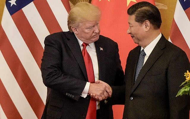 US President Donald Trump (L) shakes hand with China’s President Xi Jinping at the end of a press conference at the Great Hall of the People in Beijing on November 9, 2017. (AFP/Fred Dufour)