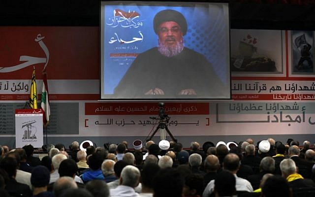 Hassan Nasrallah, the head of Lebanon's militant Shiite movement Hezbollah, giving a televised address during a gathering in Beirut's southern suburb, November 10, 2017. (AFP/ Anwar Amro)