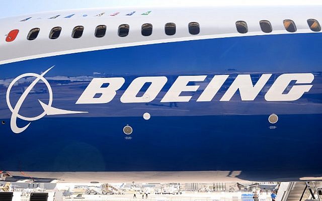 The Boeing logo on the fuselage of a Boeing 787-10 Dreamliner test plane presented on the Tarmac of Le Bourget, June 18, 2017. (AFP Photo/Eric Piermont)