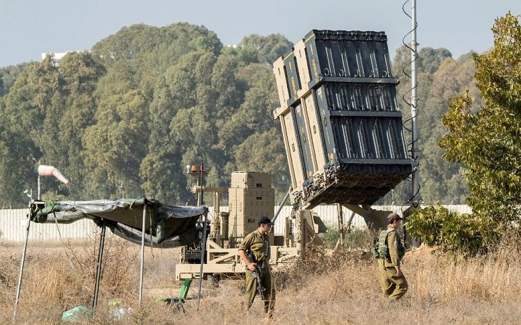 Israeli soldiers stand guard next to an Iron Dome missile defense battery in central Israel on November 14, 2017. (AFP/Jack Guez)