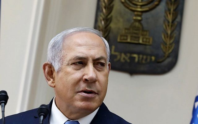 Prime Minister Benjamin Netanyahu speaks at the start of the weekly cabinet meeting at his Jerusalem office, November 26, 2017. (AFP/GALI TIBBON)