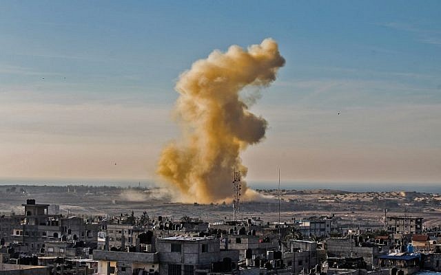 Illustrative: A picture taken on November 28, 2017, from Rafah in the southern Gaza Strip shows smoke billowing following an explosion close to the border on the Egyptian side of the divided city. (AFP Photo/Said Khatib)