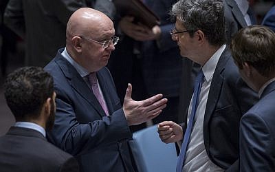 Russian envoy Vassily Nebenzia, left, speaks with France’s François Delattre at a Security Council meeting on Syrian chemical weapons use on October 24, 2017. (UN/Cia Pak)
