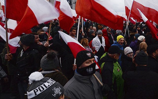 Far-right demonstrators wave Polish flags during the annual march to commemorate Poland's National Independence Day in Warsaw, Saturday, November 11, 2017. (AP Photo/Czarek Sokolowski)