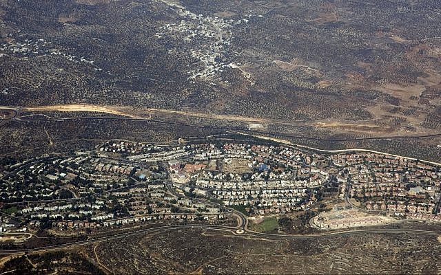This September 20, 2010, aerial file photo, taken through the window of an airplane shows the West Bank settlement of Ariel. (AP Photo/Ariel Schalit, File)