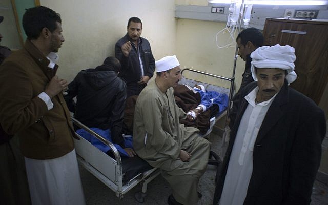 Relatives of Sheikh Sulieman Ghanem, 75, center, surround him as he receives medical treatment at Suez Canal University hospital in Ismailia, Egypt, Friday, Nov. 24, 2017, after he was injured during a terror attack on a mosque -- the deadliest ever attack by Islamic extremists in Egypt. (AP Photo/Amr Nabil)