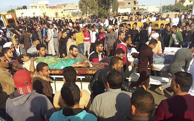 Injured people are evacuated from the scene of a terrorist attack on a mosque in Bir al-Abd in the northern Sinai Peninsula of Egypt on November 24, 2017. (AP Photo)