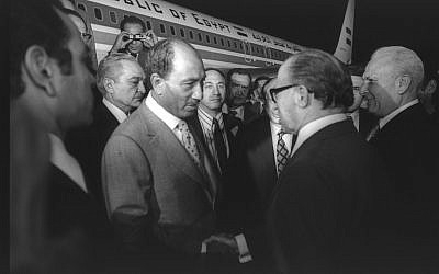 Prime minister Menachem Begin welcomes Egyptian president Anwar Sadat at Ben Gurion Airport on November 19, 1997 (Moshe Milner/GPO archive)