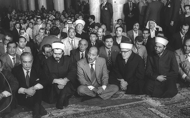 Egyptian president Anwar Sadat prays at the al-Aqsa mosque in Jerusalem on November 20, 1977 (Miki Tzarfati/GPO archive)