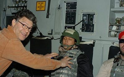 A photograph released by Leeann Tweeden on November 16, 2017, which shows her sleeping on board an aircraft, with Al Franken shown reaching out as if to grope her breasts (Twitter)
