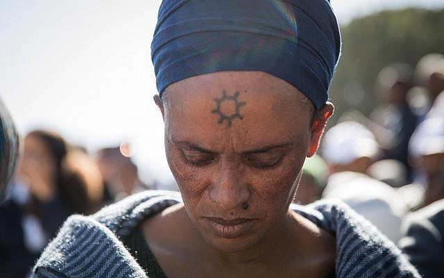 Members of the Ethiopian Jewish community in Israel take part in a prayer of the Sigd holiday on Armon Hanatziv Promenade overlooking Jerusalem on November 16, 2017. (Hadas Parush/Flash90)
