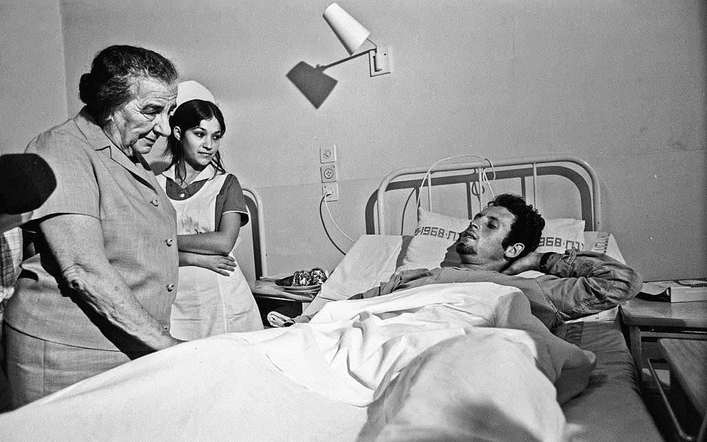 Then-prime minister Golda Meir visiting a wounded soldier in hospital during the 1973 Yom Kippur War. (Herman Chanania/GPO)