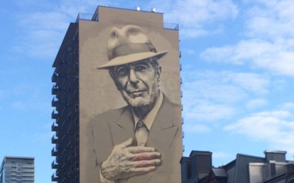 A 22-story tall portrait of Leonard Cohen on the side of a building on Montreal's Crescent Street. (Robert Sarner/Times of Israel)