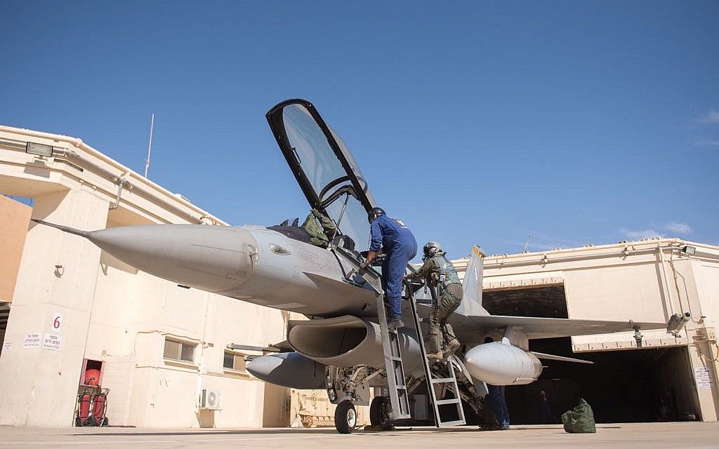 A pilot climbs into an F-16 fighter jet as part of the international Blue Flag exercise in early November 2017. (Israel Defense Forces)