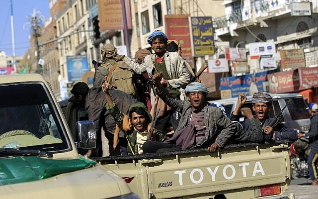 Houthi rebel fighters are seen riding an armored vehicle outside of the residence of Yemen's former president Ali Abdullah Saleh in Sana'a on December 4, 2017. (AFP PHOTO / MOHAMMED HUWAIS)