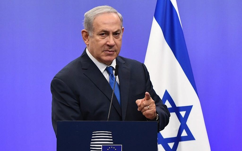 Prime Minister Benjamin Netanyahu gestures as he speaks during a joint press conference with the EU foreign policy chief, at the European Council in Brussels on December 11, 2017. (AFP/Emmanuel Dunand)