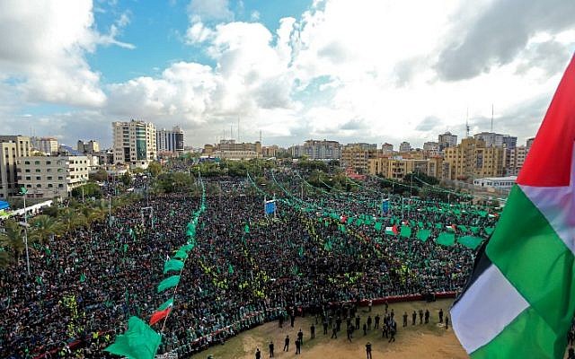 Hamas supporters take part in a rally marking the 30th anniversary of the founding of the Islamist terror movement, in Gaza City, on December 14, 2017.  (MOHAMMED ABED / AFP)