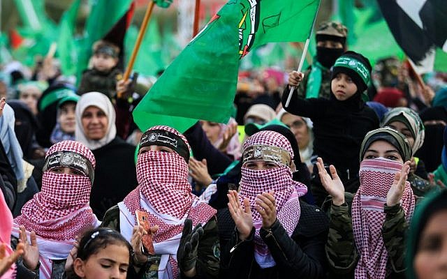 Illustrative: Hamas supporters take part in a rally marking the 30th anniversary of the founding of the Islamist terror movement, in Gaza City, on December 14, 2017.  (Mohammed Abed/AFP)