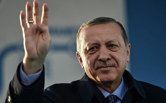Turkish President Recep Tayyip Erdogan makes a four-finger (rabia) sign during a speech in Istanbul, December 15, 2017. (Ozan Kose/AFP)