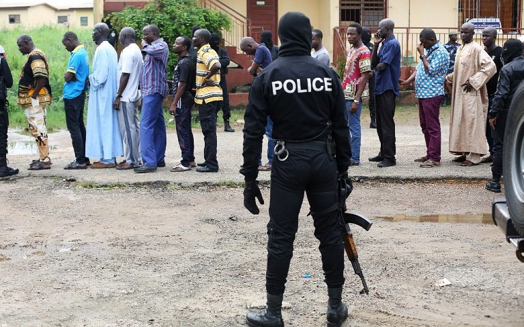 Following a knife attack on two Danish nationals, police question detained Muslim retail traders in Libreville, Gabon, December 17, 2017. (Steve JORDAN/AFP)