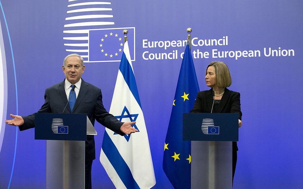European Union High Representative Federica Mogherini, right, and Prime Minister Benjamin Netanyahu address a media conference at the EU Council building in Brussels on Monday, December 11, 2017. (AP Photo/Virginia Mayo)