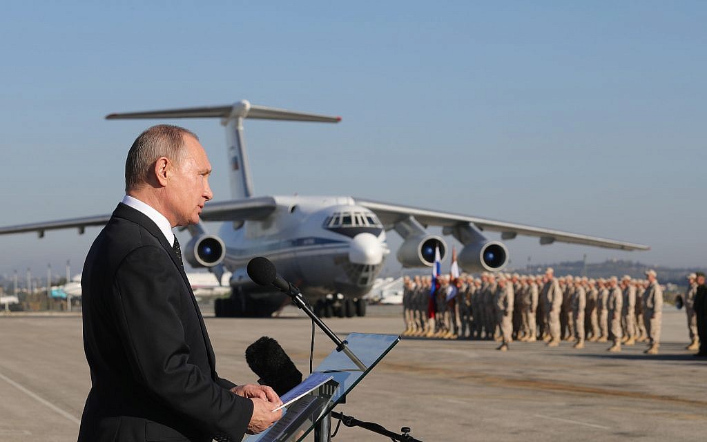 Russian President Vladimir Putin addresses troops at the Hemeimeem air base in Syria, December 11, 2017. (Mikhail Klimentyev, Sputnik, Kremlin Pool Photo via AP)