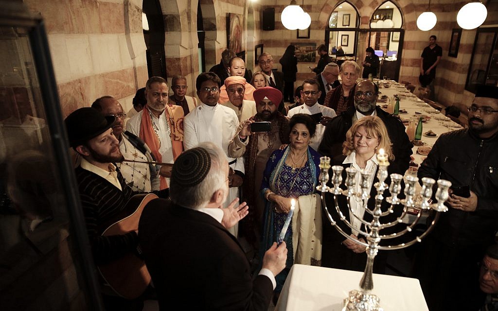 Illustrative: An interfaith group from the Gulf state of Bahrain attends Hanukkah candle lighting in Jerusalem, December 12, 2017. (AP Photo/Mahmoud Illean)