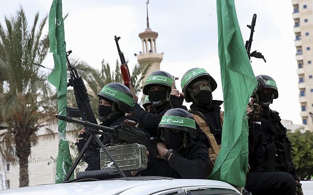 File: Masked operatives from the Izz ad-Din al-Qassam Brigades, the military wing of the Hamas terror group, ride vehicles as they commemorate the 30th anniversary of their group, in Gaza City, December 13, 2017. (AP Photo/Adel Hana)