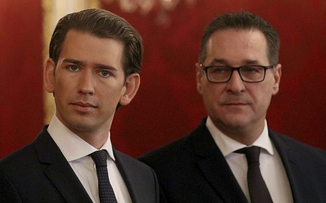 Foreign Minister and leader of the Austrian People's Party, OEVP, Sebastian Kurz, left,  and Heinz-Christian Strache, chairman of the right-wing Freedom Party, FPOE, listen after meeting wiih Austrian President Alexander van der Bellen on forming a new coalition government, at the Hofburg palace in Vienna, Austria, Saturday, Dec. 16, 2017. (AP Photo/Ronald Zak)
